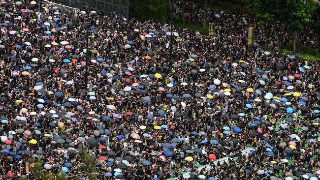 Rain has not stopped protesters gathering for a rally in Victoria Park. Picture: AFP