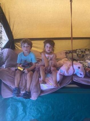 Xzavier and Jordyn inside their great-grandad's campervan, which is parked in their grandma's backyard. Picture: Supplied