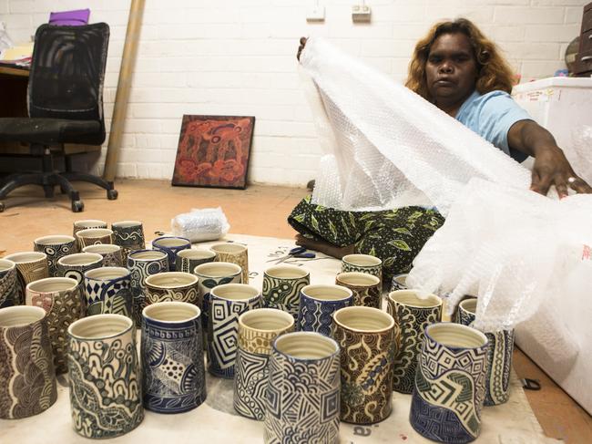 Preparing ceramic beakers at Ernabella Arts. Picture: Stephanie Simcox