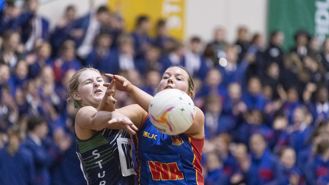 Mykah Bryant (left) of St Ursula's Senior B and Eden Fechner of Downlands Second VII in Merici-Chevalier Cup netball at Salo Centre, Friday, July 19, 2024. Picture: Kevin Farmer