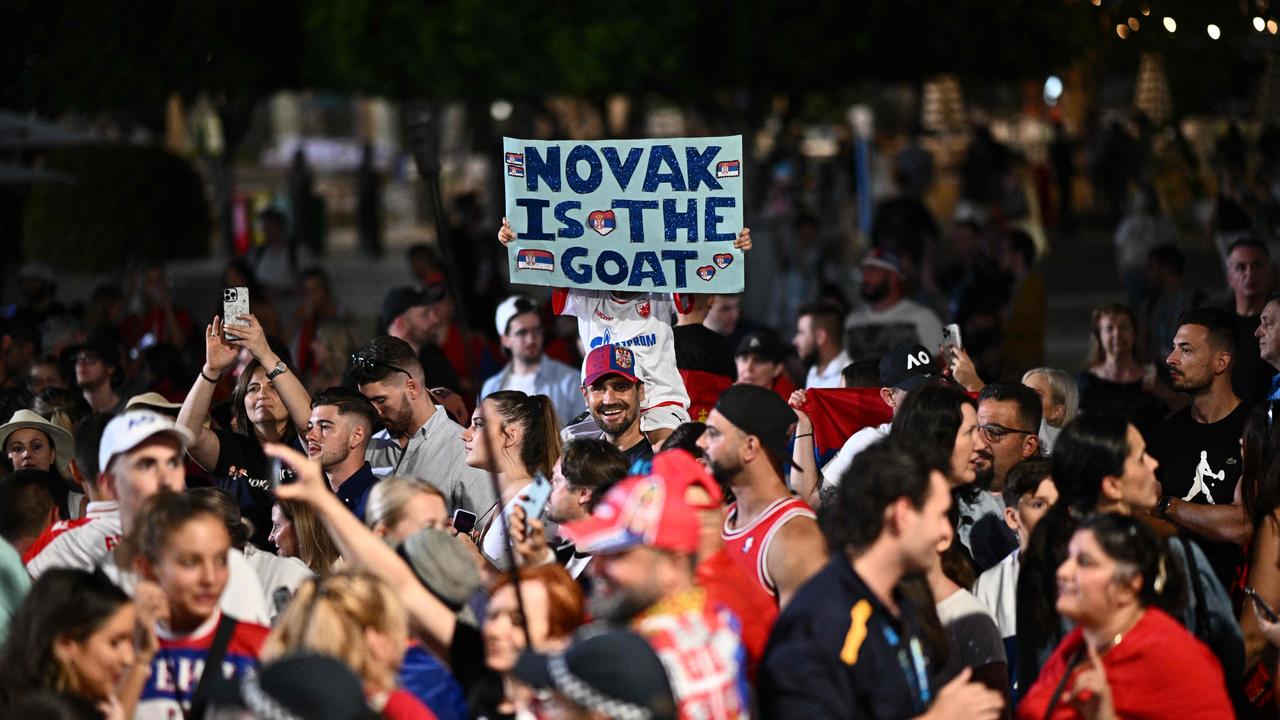 Supporters of Serbia's Novak Djokovic gather.