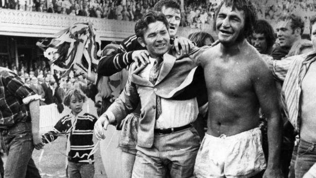 Coach Ron Willey (suit) and captain Fred Jones (no jersey) after winning the 1972 grand final at the SCG in Sydney.