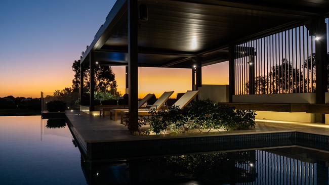 A gazebo overlooks the inground pool.