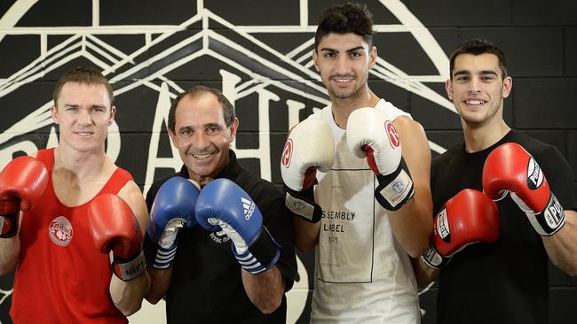 Edgardo (middle, right), with father Charlie (middle, left) and fellow Para Hills boxers David Biddle (left) and Adrian Cammarano in 2019. The club won the Boxing SA Club of the Year award in 2015. picture: Bianca De Marchi