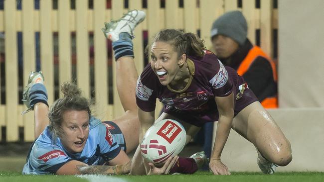 Karina Brown scores a try during the Women's State of Origin match. Picture: AAP