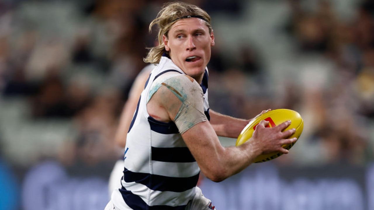 MELBOURNE, AUSTRALIA - JULY 16: Mark Blicavs of the Cats runs with the ball during the round 18 AFL match between the Carlton Blues and the Geelong Cats at Melbourne Cricket Ground on July 16, 2022 in Melbourne, Australia. (Photo by Darrian Traynor/Getty Images)