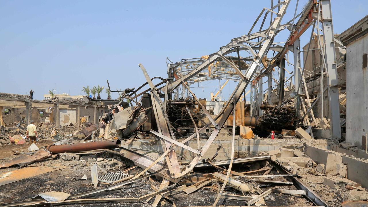 People check the destruction at a power station at the port in Yemen's rebel-held Hodeida city on September 30, a day after it was targeted in Israeli strikes. Picture: AFP