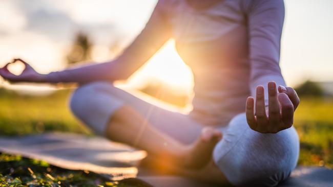 Meditation and mindfulness are some ways to stay present during this uncertain time. Photo: iStock