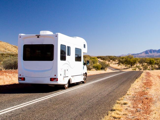 Campervan travelling on 1`Namatjira Drive near Mt Zeil in Northern Territory, Australia