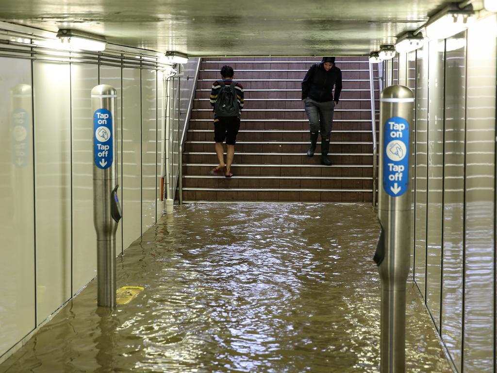 Commuters struggle against torrential rain and gale force winds in Lewisham as Sydney is lashed with a monumental early summer storm, 28/11/18. Picture: Nicholas Eagar