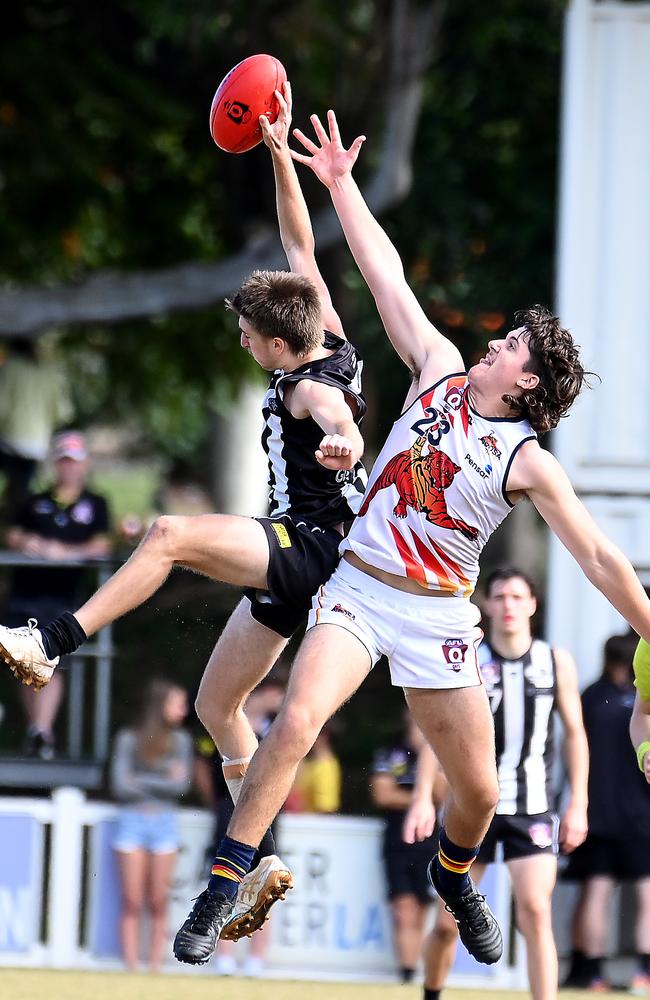 Sherwood player James Preston and Noosa player Max Joyce. Picture, John Gass