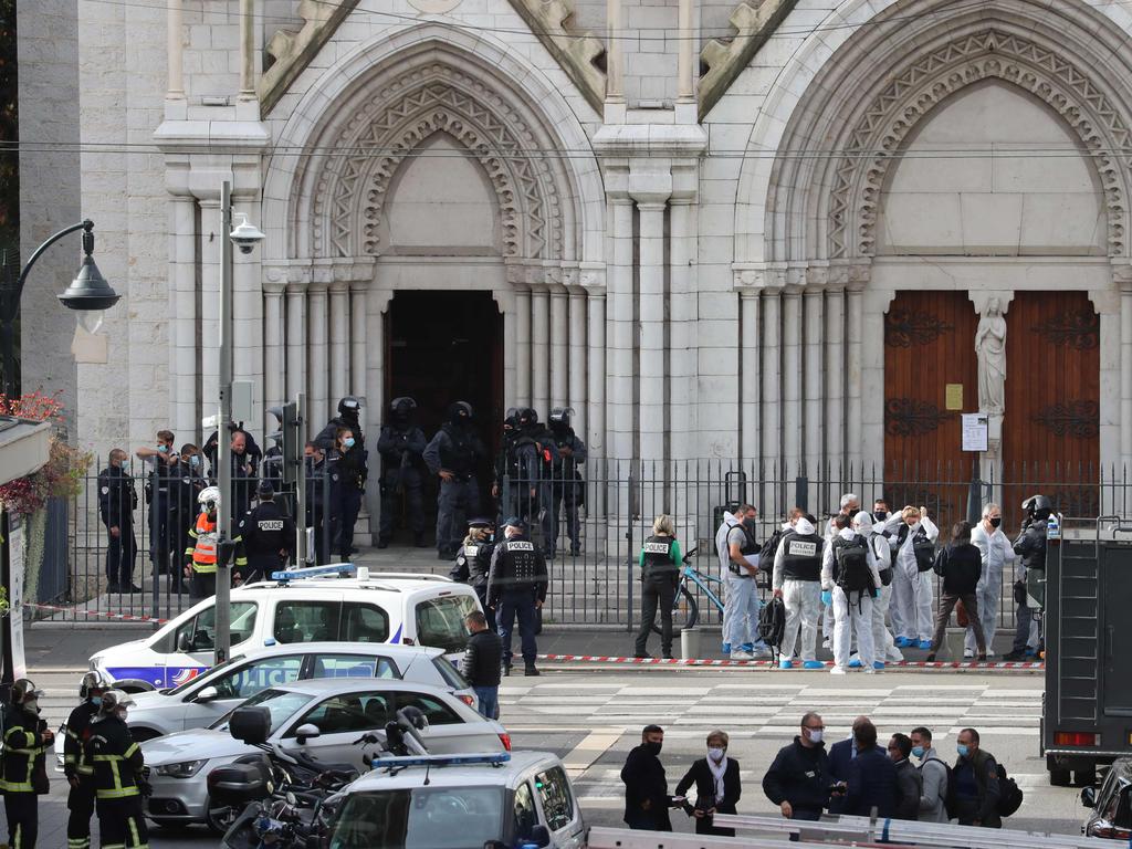 French members of the elite tactical police unit RAID enter to search the Basilica of Notre-Dame de Nice. Picture: Valery Hache/AFP