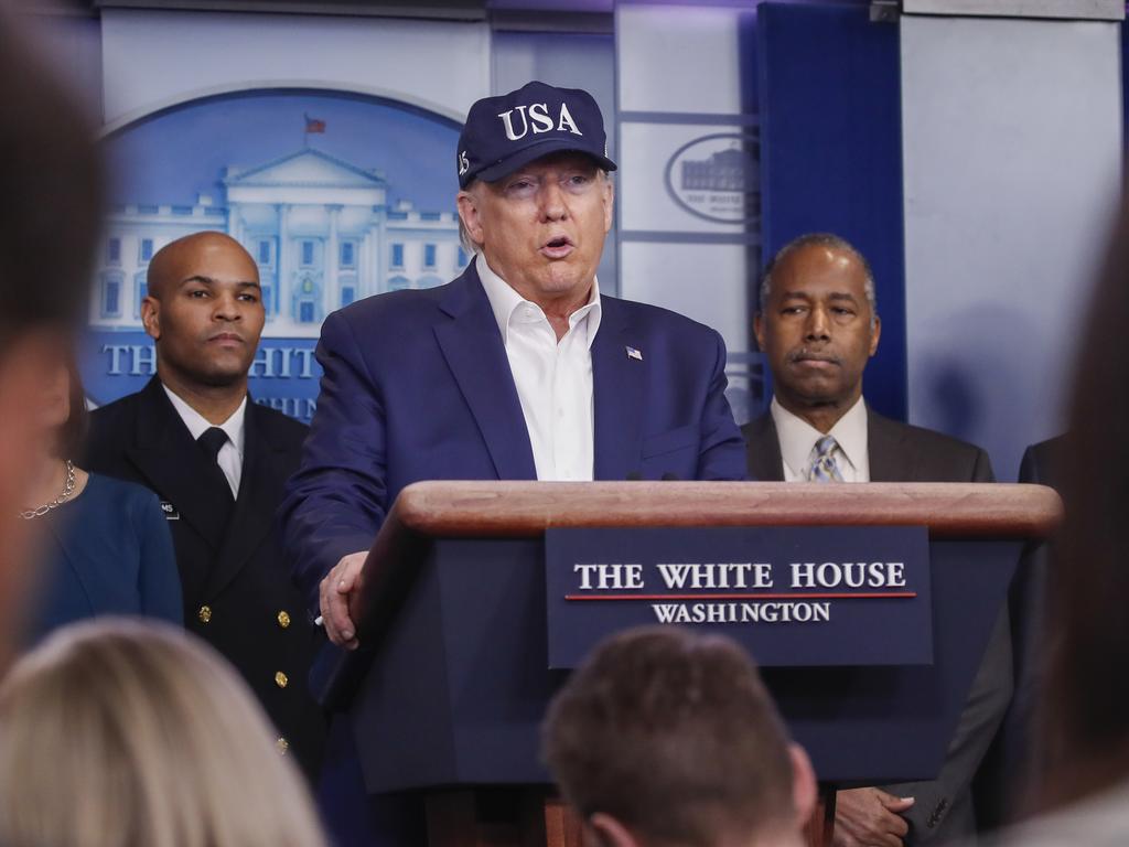 President Donald Trump speaks during a briefing on coronavirus in the Brady press briefing room at the White House, Saturday, March 14, 2020, in Washington, as U.S. Surgeon General Jerome Adams and Housing and Urban Development Secretary Ben Carson listen. Picture: Alex Brandon