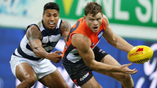 Heath Shaw beats Geelong’s Tim Kelly to the ball last Friday night. Picture: Michael Klein