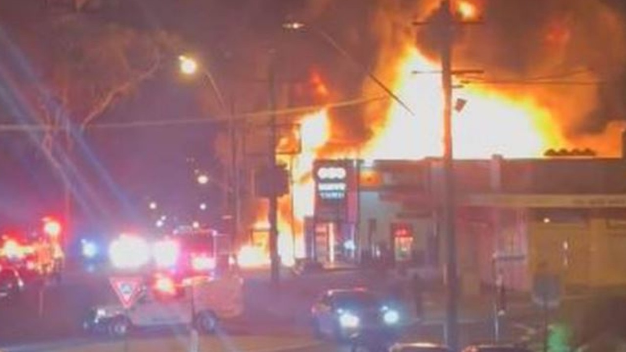A Campbelltown service station has been engulfed in flames after the complex exploded overnight. Picture: Facebook