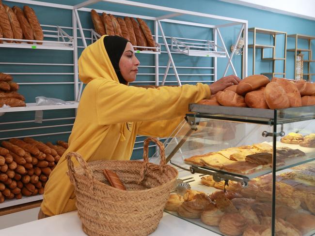 A staff member arranges baked goods at a bakery in Tunis. Since the Russian invasion of Ukraine began, with both countries wheat suppliers for Maghreb countries, prices of flour and semolina have soared in the region. Picture: Anis Mili / AFP