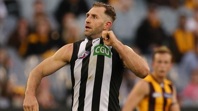 Travis Cloke pulls his Collingwood jumper after kicking a goal. Picture: Wayne Ludbey