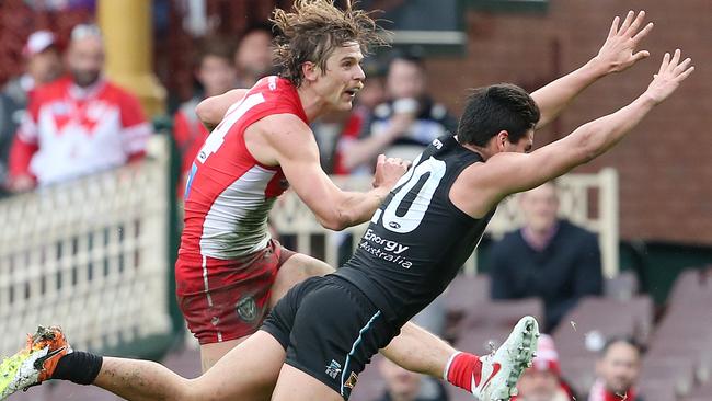 Dane Rampe kicks out of defence.