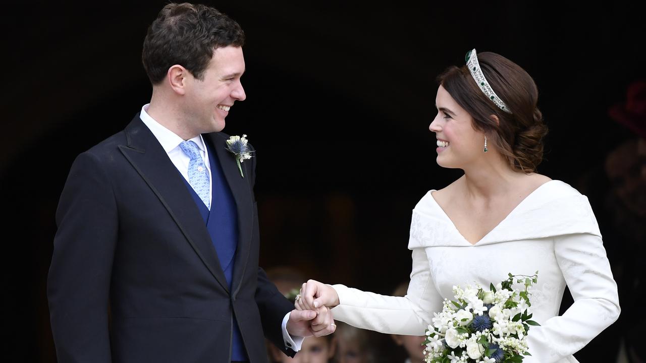 Look of love. Princess Eugenie and Jack Brooksbank leave St George's Chapel after their wedding. Picture: Toby Melville, Pool via AP
