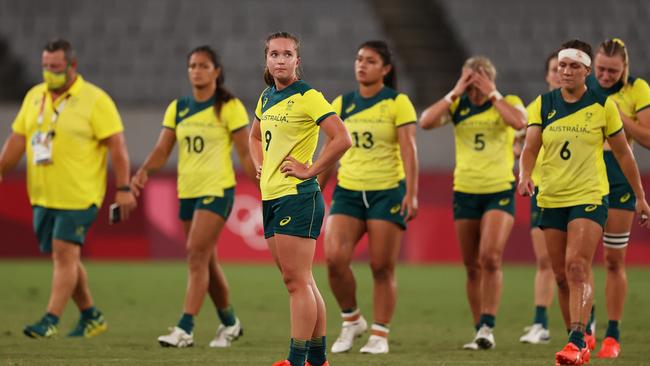 CHOFU, JAPAN - JULY 30:  Tia Hinds of Team Australia and team mates look dejected at full time in the WomenÃ¢â¬â¢s Quarter Final match between Team Fiji and Team Australia during the Rugby Sevens on day seven of the Tokyo 2020 Olympic Games at Tokyo Stadium on July 30, 2021 in Chofu, Tokyo, Japan. (Photo by Dan Mullan/Getty Images)