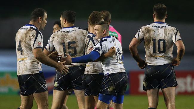 Scotland players celebrate after their Four Nations draw against New Zealand.