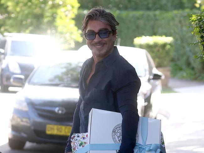 John Ibrahim arrives at Otto’s first birthday, gift in tow. Picture: Matrix