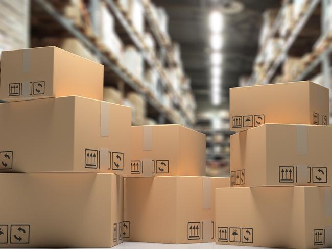 Cardboard boxes on blur storage warehouse shelves background, Distribution, cargo and logistics concept. 3d illustration