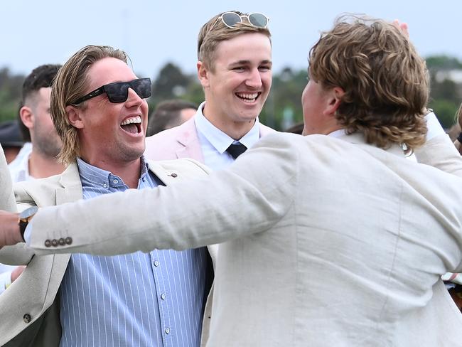 MELBOURNE, AUSTRALIA - NOVEMBER 01: Fans celebrate White Marlin winning Race 2, the The Macca's Run, during 2022 Lexus Melbourne Cup Day at Flemington Racecourse on November 01, 2022 in Melbourne, Australia. (Photo by Quinn Rooney/Getty Images)