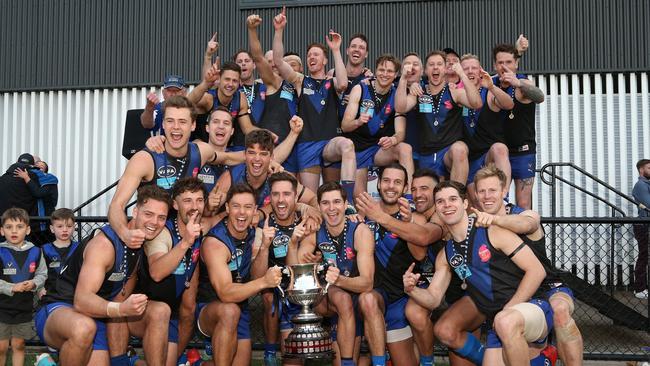 University Blues celebrate with the trophy after the VAFA Premier Grand Final against St Kevin's in 2019. Picture: Hamish Blair