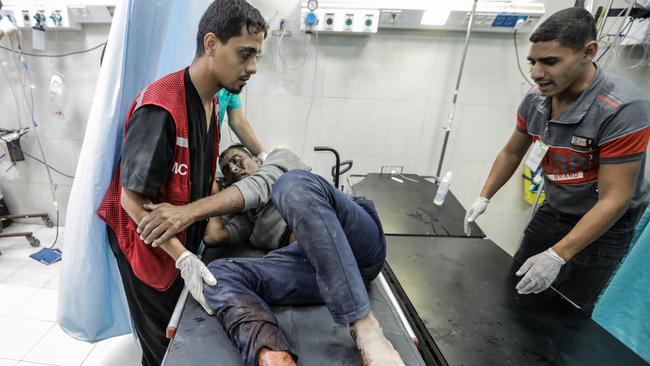 Palestinians injured in Israeli raids arrive at Nasser Medical Hospital on November 13, 2023 in Khan Yunis, Gaza. Picture: Ahmad Hasaballah/Getty Images