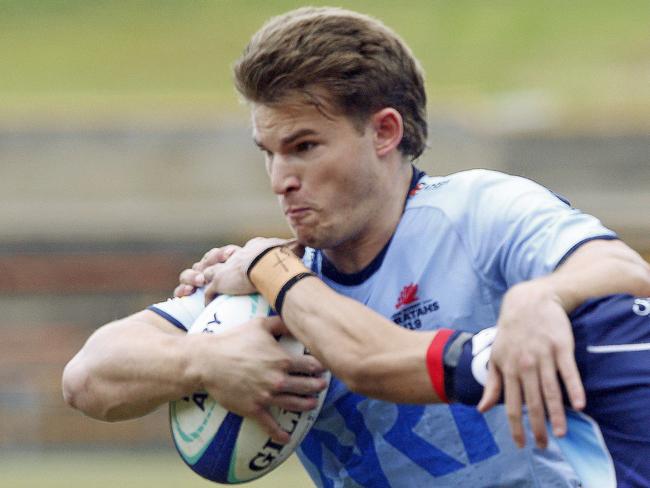 Waratahs Liam Grover is tackled by Melbourne Rebels Christian Lealofi. Under 19s Waratahs  v Melbourne Rebels in Super Rugby National Championships Round 1 at Leichhardt Oval. Picture: John Appleyard.