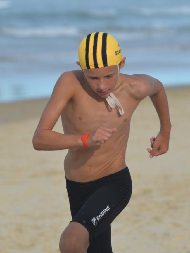 Running action at the Queensland Youth Surf Life Saving Championships on February 17.