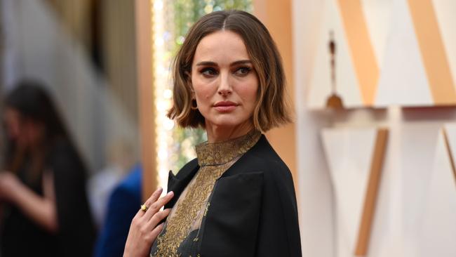 Natalie Portman arrives on the red carpet with her protest cape on Monday. Picture: AFP