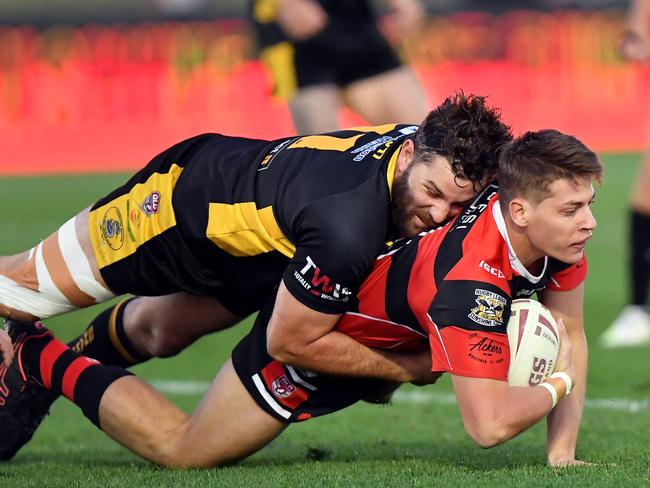 Stanley River’s Cory Parker being tackled by Caboolture in last year’s grand final.