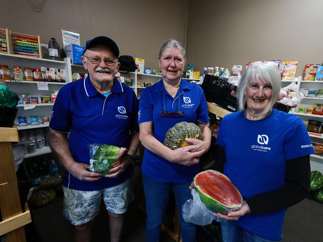 Foodbank delivers $50,000 worth of food and supplies, donated by The Daily Telegraph, to local community pantries in Taree for flood victims. Pictured is (left) Mick Brooks, Debbie Burham and Lyn Iverson from Global Care. Picture: Supplied