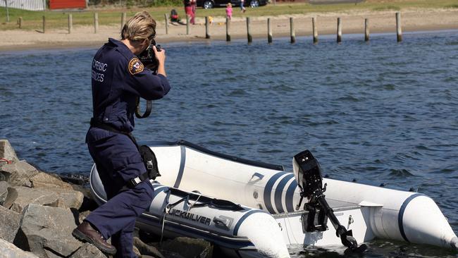 Police photographing the Four Winds dinghy in 2009.