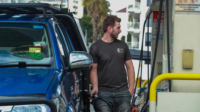 Apprentice carpenter Brandon Charlton fills up at BP Rushcutters Bay in Sydney. Picture: Justin Lloyd