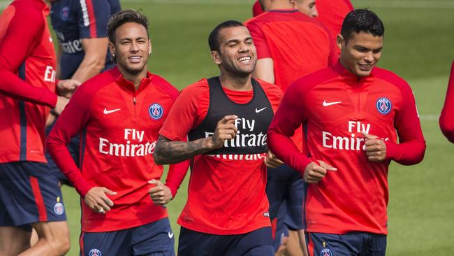 From left, Paris Saint-Germain's Neymar, Dani Alves and Thiago Silva during a training session.