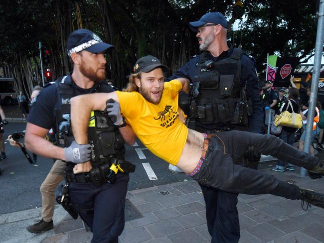 BRISBANE, AUSTRALIA - NewsWire Photos - DECEMBER 10, 2020.A protester is being arrested at an Extinction Rebellion protest in BrisbaneÃs CBD.Picture: NCA NewsWire / Dan Peled