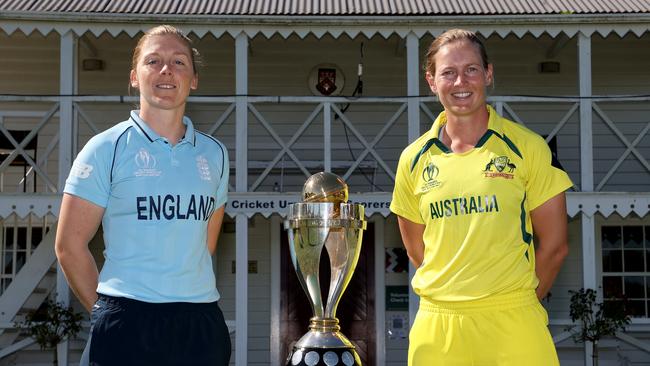 England captain Heather Knight (left) and Australian captain Meg Lanning pose with the ICC women’s cricket World Cup trophy. Picture: Getty Images