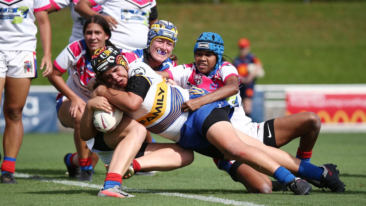 Kangaroos' Aerielle Hobbler crashes through the Maidens' defence to score her third try in the 2021 Cairns District Rugby League Women's (CDRLW) grand final match between the Cairns Kangaroos and the Ivanhoe Maidens at Barlow Park. Picture: Brendan Radke