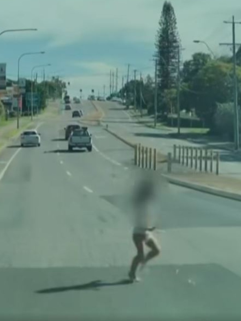 A toddler can be seen dashing across a busy motorway. Picture: 7NEWS