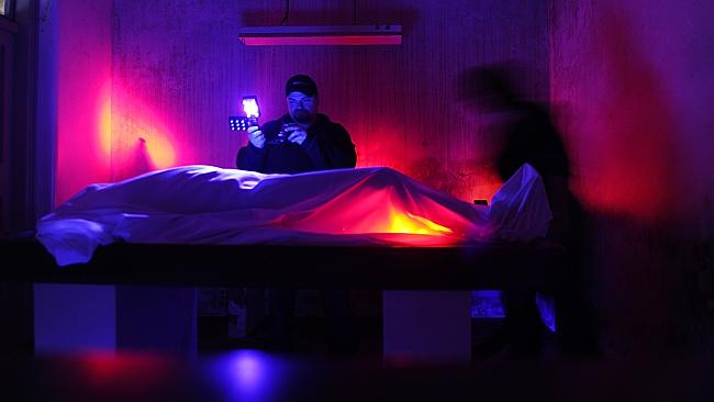 Paranormal investigators Robert Coble and Anne Rzechowicz investigate the morgue before hosting tours at Q Station in Manly. Picture: Supplied