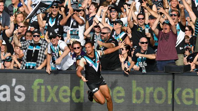 Steven Motlop celebrates a goal in his Port Adelaide debut.