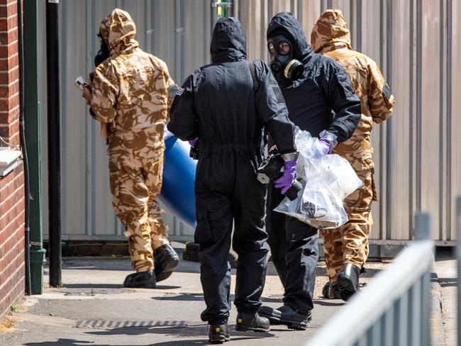 Emergency workers in protective suits search around John Baker House Sanctuary Supported Living after a major incident was declared when a man and woman were exposed to the Novichok nerve agent. Picture: Getty