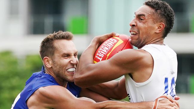 Aiden Bonar tries to break through a tackle from teammate Jamie MacMillan.