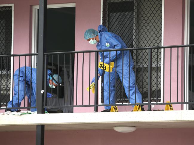 Forensic police examine the scene where Ms Ayliffe-Chung died. Lyndon Mechielsen/The Australian