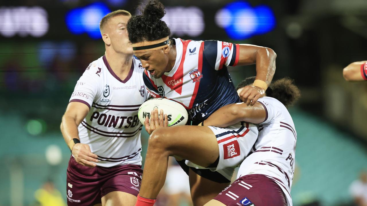 SYDNEY, AUSTRALIA - MARCH 18: Sitili Tupouniua of the Roosters is tackled during the round two NRL match between the Sydney Roosters and the Manly Sea Eagles at Sydney Cricket Ground, on March 18, 2022, in Sydney, Australia. (Photo by Mark Evans/Getty Images)