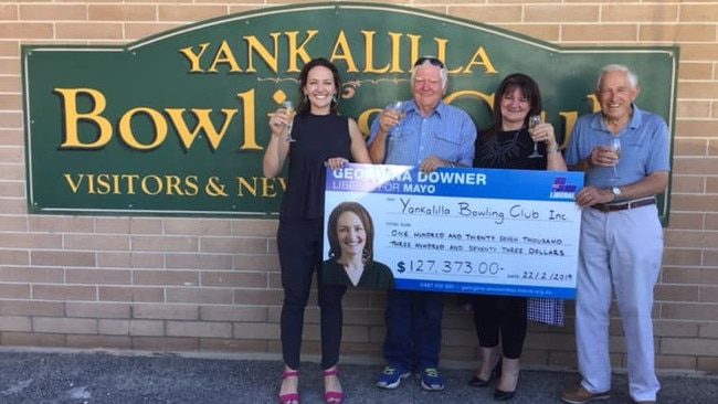 A cheeky wee drop as Georgina Downer hands over a large novelty wallet-stuffer. Source: Facebook