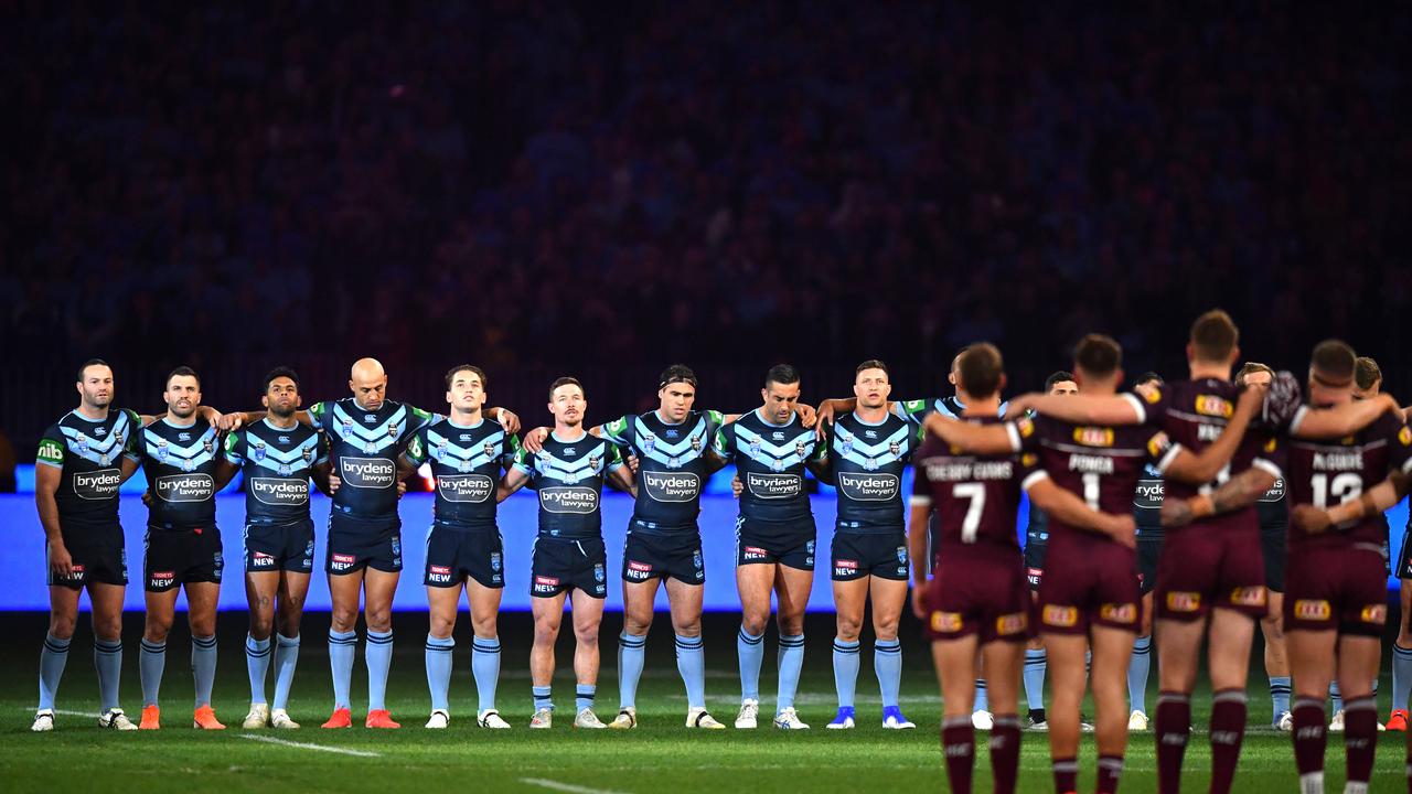 Players are seen lined up for the national anthem before Game 2 of the 2019 State of Origin series between the Queensland Maroons and the New South Wales Blues at Optus Stadium in Perth, Sunday, June 23, 2019. (AAP Image/Darren England) NO ARCHIVING, EDITORIAL USE ONLY